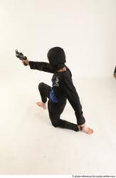 Man Young Athletic Fighting with gun Kneeling poses Casual Asian